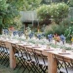 wedding table set with chairs and flowers