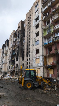 Photo for Kyiv, Ukraine - January 5, 2024: A residential building destroyed by a Russian missile strike on the Ukrainian capital on January 2, 2024. Rescuers and communal workers are removing the rubble. - Royalty Free Image
