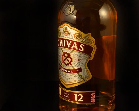 Photo for Chivas Regal blended Scotch whisky on black background. Whisky is a major export item of Scotland - illustrative editorial - Royalty Free Image