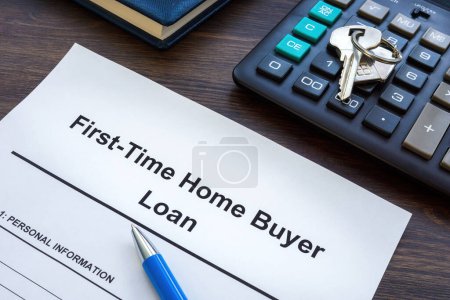 Photo for First time home buyer loan application and metal key. - Royalty Free Image