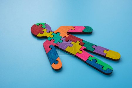 Photo for Figure of man made of multi-colored puzzle pieces. Autism or neurodiversity concept. - Royalty Free Image