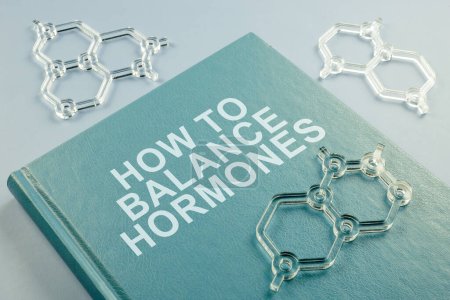 Photo for A Book how to balance hormones and chemical models. - Royalty Free Image