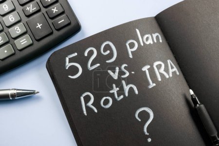 Photo for An Open notepad with sign 529 plan vs Roth IRA. - Royalty Free Image