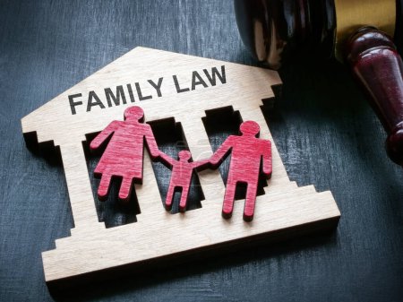A Plate with sign family law, figurines and gavel.