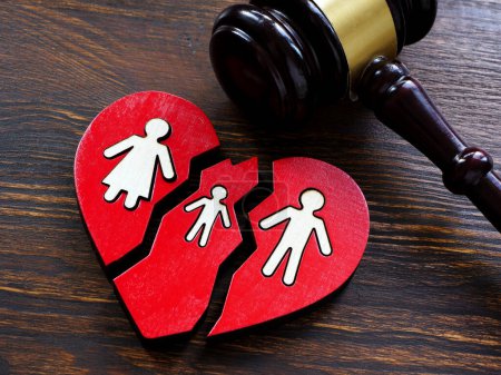 Broken heart and gavel as a symbol of divorce and guardianship.
