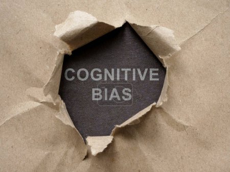 Photo for A torn piece of paper with an inscription Cognitive bias. - Royalty Free Image