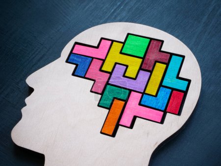 Photo for A head with a multi-colored puzzle inside as a symbol of autism or neurodiversity. - Royalty Free Image