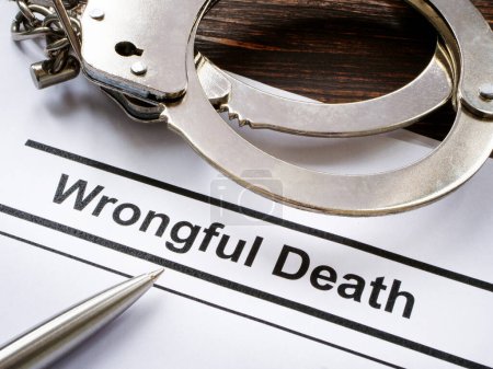 Photo for Documents about Wrongful death and handcuffs. - Royalty Free Image