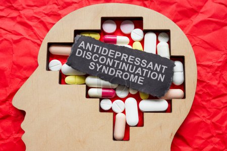 Head with pills and inscription antidepressant discontinuation syndrome ASD.