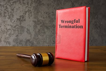 Photo for Rules about wrongful termination and a gavel. - Royalty Free Image