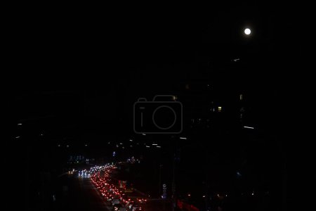 Photo for Kyiv, Ukraine - December 16, 2022: Blackout in the Ukrainian capital Kyiv. Capital streets without street lighting. Only the lights of passing cars are visible. - Royalty Free Image