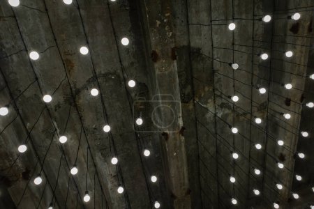 Photo for Office, factory or warehouse concrete ceiling with wires and lamps - Royalty Free Image