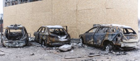 Photo for Kyiv, Ukraine - January 3, 2024: Burned civilians cars after a Russian's missiles attack. - Royalty Free Image