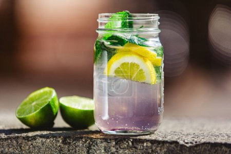 Photo for Glass of lime lemonade. Summer refreshing drinks. Homemade lemonade with lime and orange. Cold drinks - Royalty Free Image