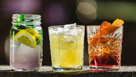 Photo for Three different alcoholic cocktails with old-fashioned glasses. - Royalty Free Image