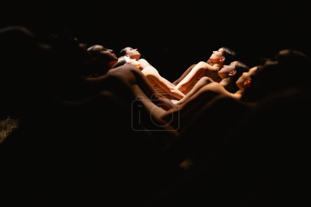 Photo for Group of modern ballet dancers. Contemporary art. Young flexible athletic men and women. Concept of dance grace, inspiration, creativity. Group of 11 models. - Royalty Free Image