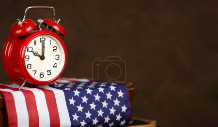 Alarm clock and USA flag. US presidential election, voting banner background with copy space. 