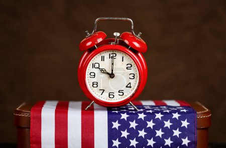 USA flag with alarm clock. Election day or voting time background with copy space.