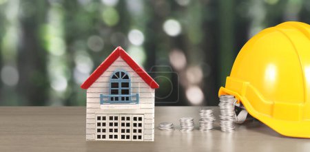 Téléchargez les photos : Jaune hardhat maison modèle et pièce avec graphique de trading, concept d'investissement financier - en image libre de droit