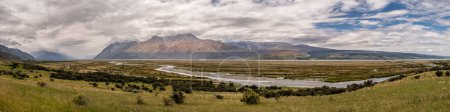 Téléchargez les photos : Panoramic view of the Tasman River valley near Mount Cook in the South Island of New Zealand with mountains in the distance - en image libre de droit