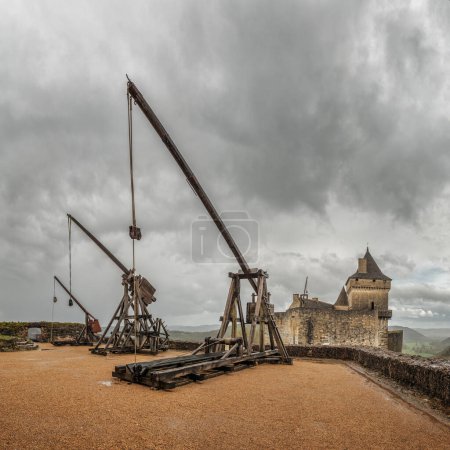 Photo for Castelnaud-la-Chapelle, Nouvelle-Aquitaine, France - 3rd April 2024: Siege weapons used in the middle ages have been re-constructed at Chateau de Castelnaud-la-Chapelle in the Dordogne region of France - Royalty Free Image