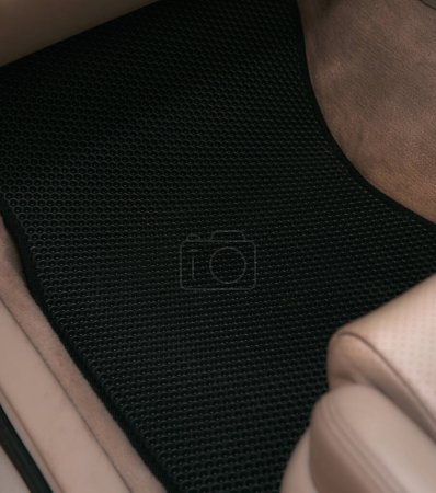 Foto de Car interior with honeycomb vinyl floor mat. - Imagen libre de derechos