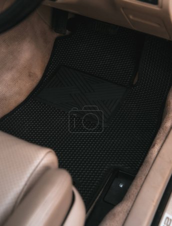 Téléchargez les photos : Eva floor mats car mats close up macro graphite gray. black floor mat to protect the vehicle interior. - en image libre de droit
