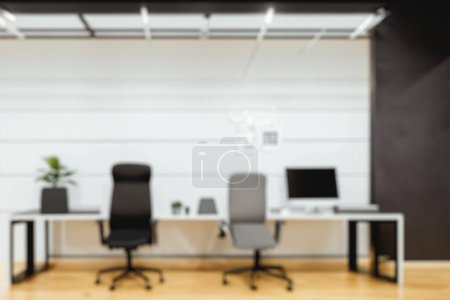 Photo for Fashionable Modern Office Interiors. Front View of a Loft Open Space. Bokeh background for meeting and presentation. - Royalty Free Image
