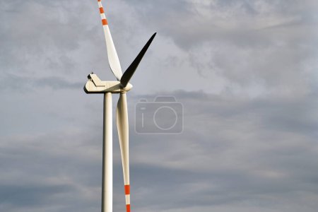 Photo for Wind turbines in a wind farm in a beautiful natural environment on a sunny summer day. Renewable energy in Europe - Royalty Free Image