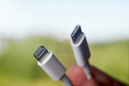 Photo for 08.09.2023 Poland, Europe. Lighting and Usb-c cable Charger on. EU to force Apple iPhone to use Usb-c instead of Lighting Cable in upcoming iPhone 15. - Royalty Free Image