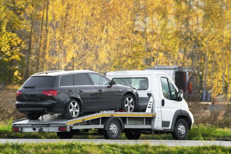 A tow truck recovery with a flatbed can transport your vehicle to safety and provide roadside assistance.