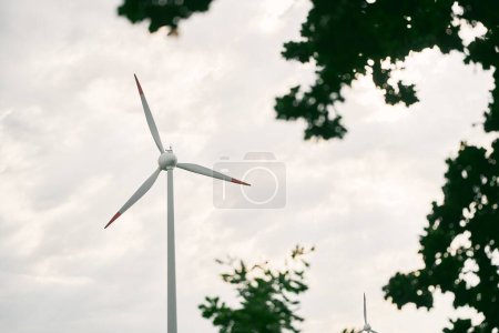 A Wind Turbine Captures Energy Amidst a Cloudy Sky
