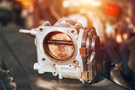 The carbon deposits on the throttle body reduce the air intake and affect the idling RPM of the engine. A mechanic can fix this problem by removing the valve and using a cleaner spray and a brush.