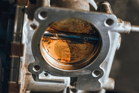 Electronic throttle body covered with carbon deposits can cause bad idling and MPG of the car or truck.