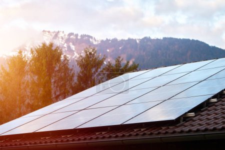 Energy-Efficient Home in Alpine Setting: Solar Panels on Roof