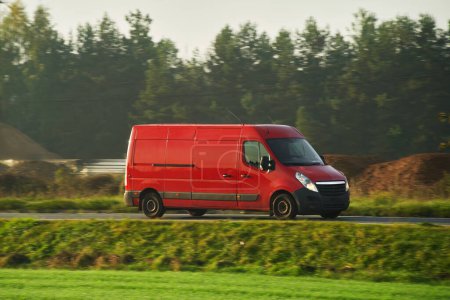 Commercial delivery van transports goods, symbolizing the relentless pace of modern commerce.