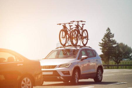 Mounted sport mountain bicycle silhouette on the car