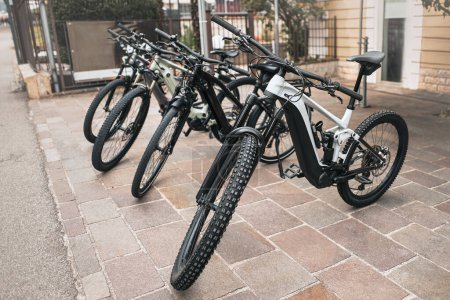 Dual Suspension Crosscountry E-Bike Escapade for sale. Row of extreme MTB bikes for downhill.