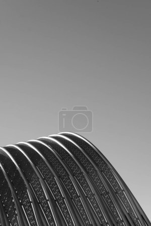 Photo for Metallic tubes held together with mesh in black and white. - Royalty Free Image