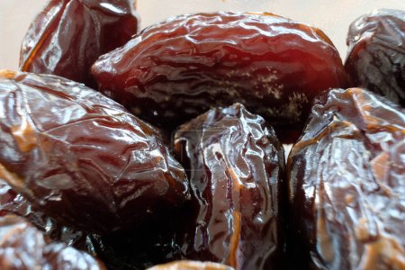 Juicy medjool dates close up with limited focus