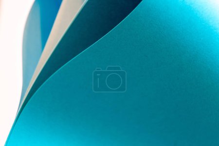 Photo for Wavy and curved papers in shades of blue forming abstract shapes - Royalty Free Image