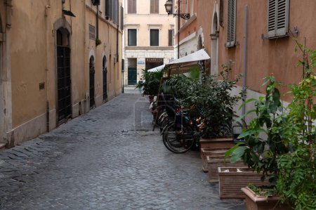 Photo for Rome, Italy - October 22, 2022: Narrow streets in the center of Rome. residential areas. Paved sidewalk. - Royalty Free Image