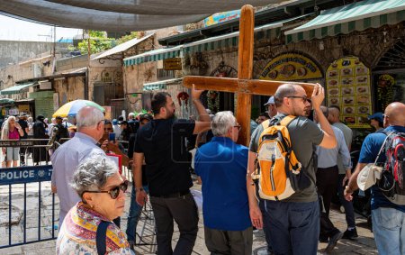 Photo for Jerusalem, Israel - September 1, 2023. procession of pilgrims with a large wooden cross in the old town. High quality photo - Royalty Free Image
