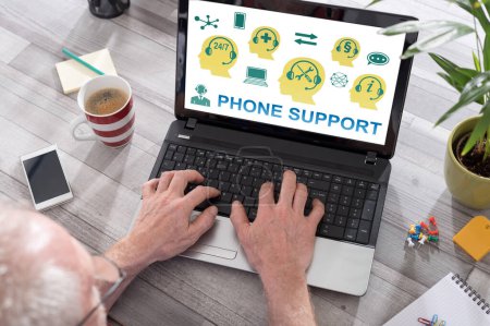 Photo for Phone support concept shown on a laptop used by a man - Royalty Free Image