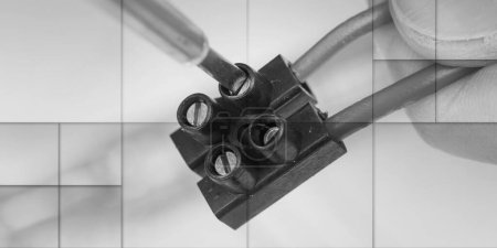 Clamping a wire in a connector, closeup, geometric pattern