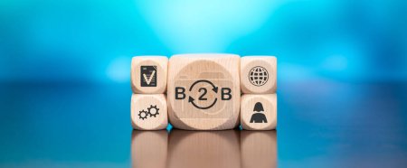 Wooden blocks with symbol of b2b concept on blue background