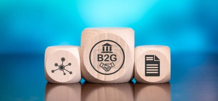 Wooden blocks with symbol of b2g concept on blue background