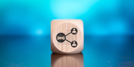 Wooden block with symbol of car sharing concept on blue background