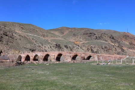 Photo for Cobandede Bridge, located in the Koprukoy district of Erzurum. The bridge belongs to the Seljuk period. - Royalty Free Image