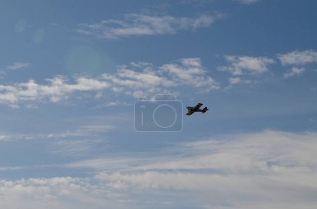 Photo for Photo of an airplane flying in the clouds. - Royalty Free Image